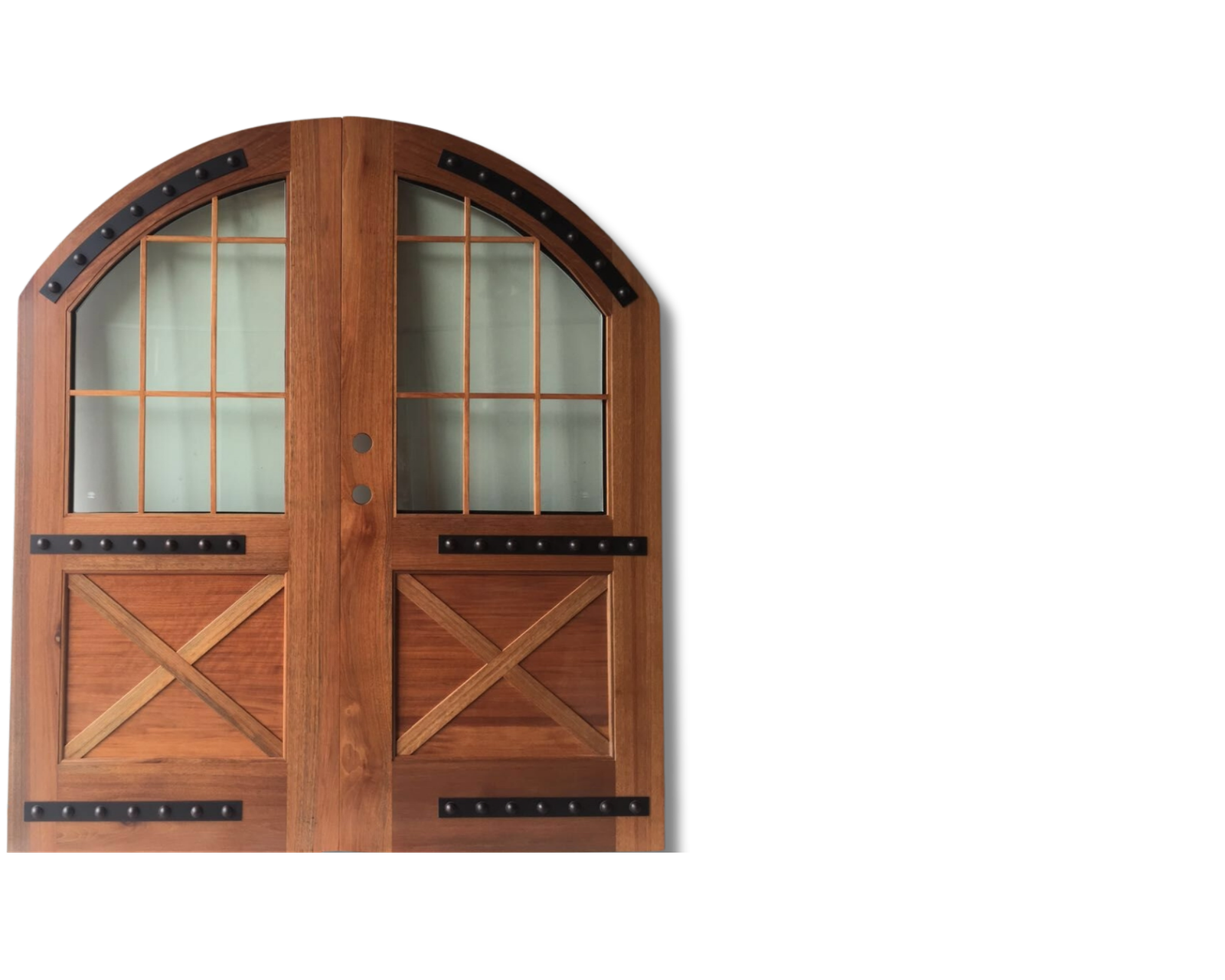 Arched wood carriage-style double doors with multi-pane frosted glass windows, black iron rivet hardware, and X-brace bottom panels