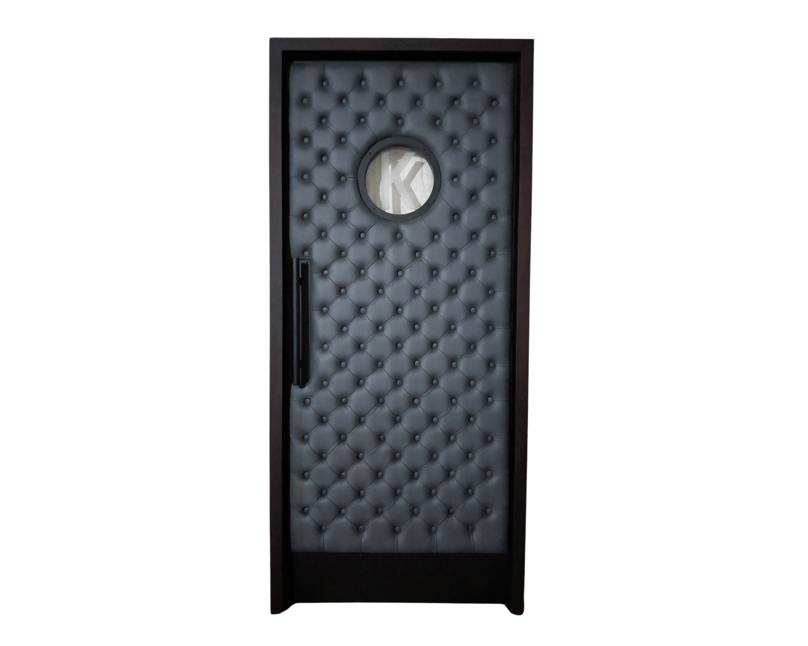Luxurious dark gray tufted single home theater door with round porthole window featuring letter "K" and modern black handle by Crown Custom Doors