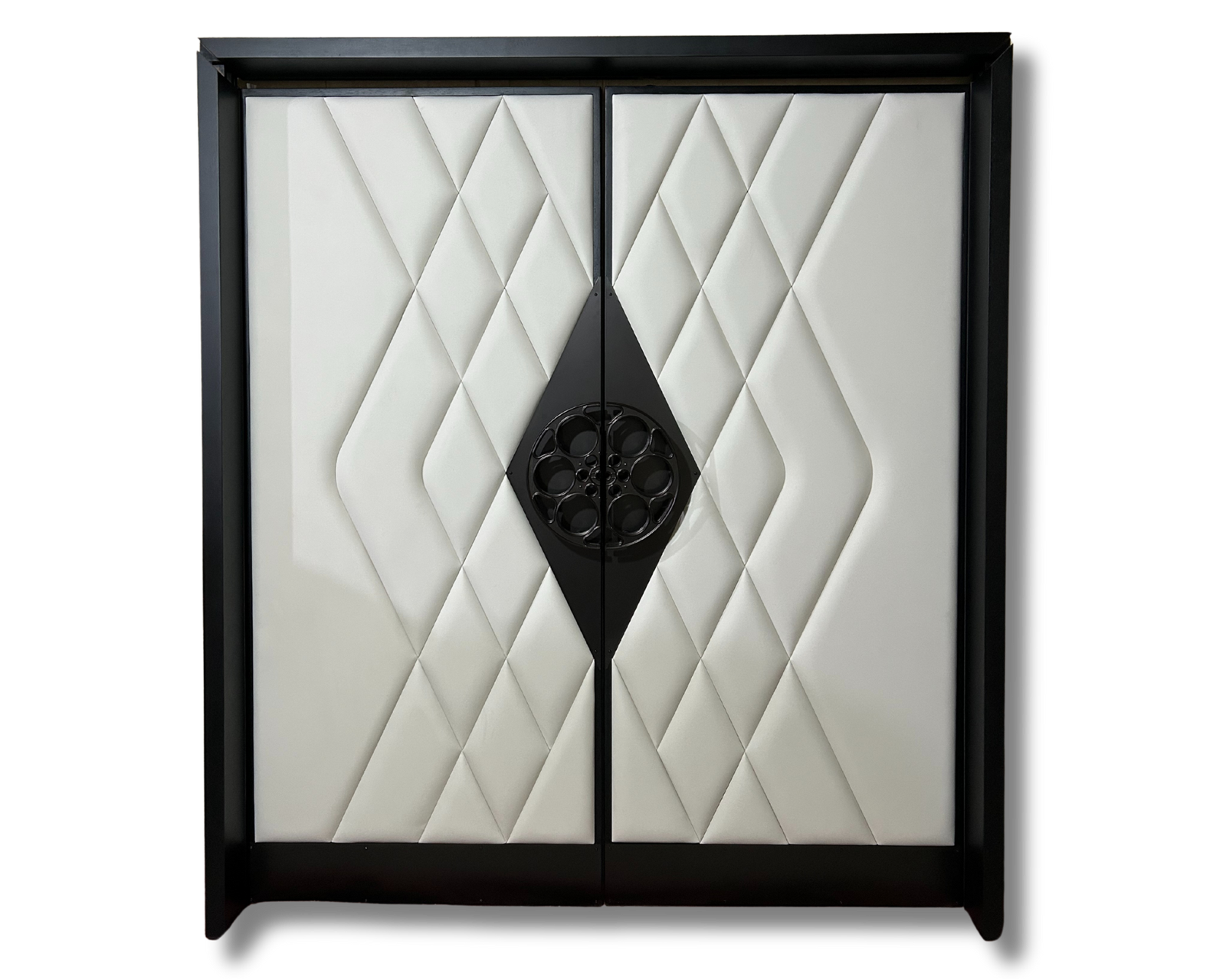 Elegant double home theater doors with white padded geometric upholstery, black framing, and a central film reel accent, installed in a luxury cinema room with movie poster decor and wood flooring