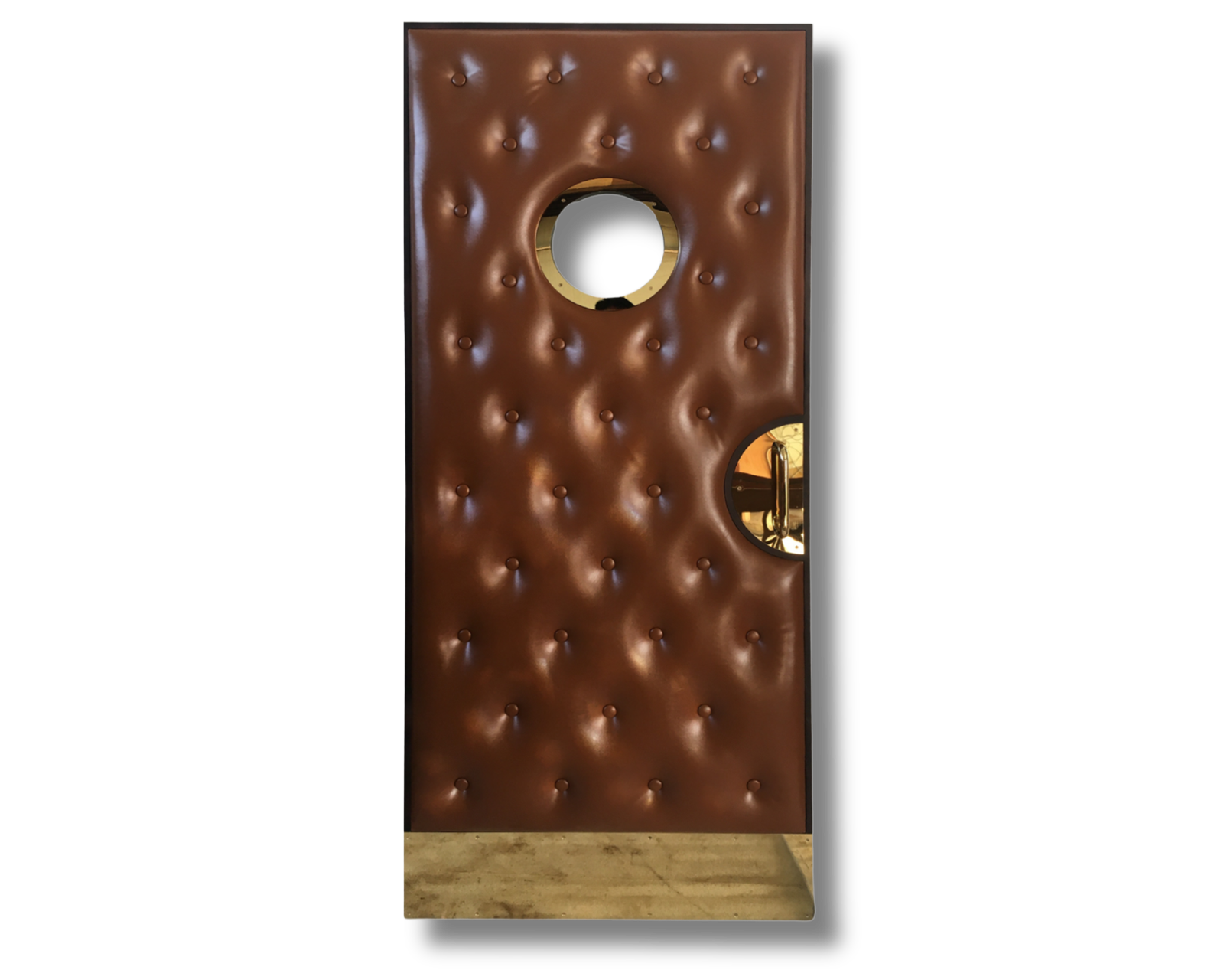 Luxurious brown tufted single home theater door with large round brass porthole window and brass hardware by Crown Custom Doors