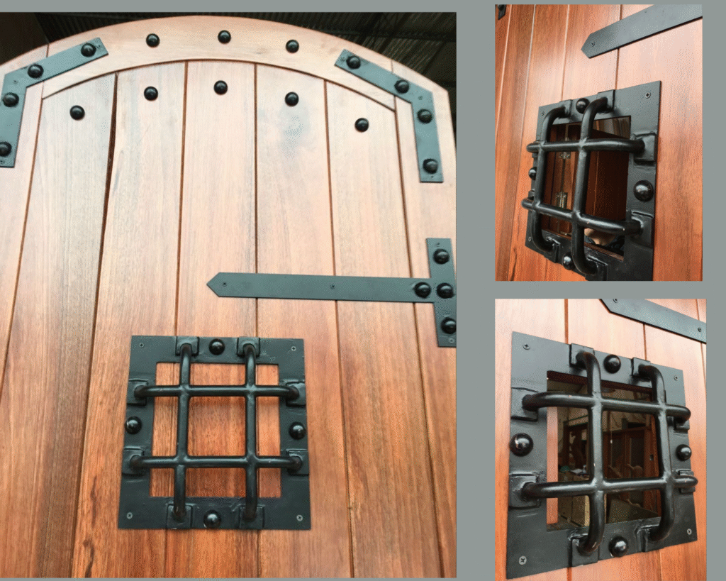 An architectural product detail graphic from Crown Custom Doors showcasing a custom solid wood arched castle gate door, featuring close-up highlight panels of the open and closed wrought iron speakeasy grille window, hand-set clavos studs, and decorative black strap hinges.