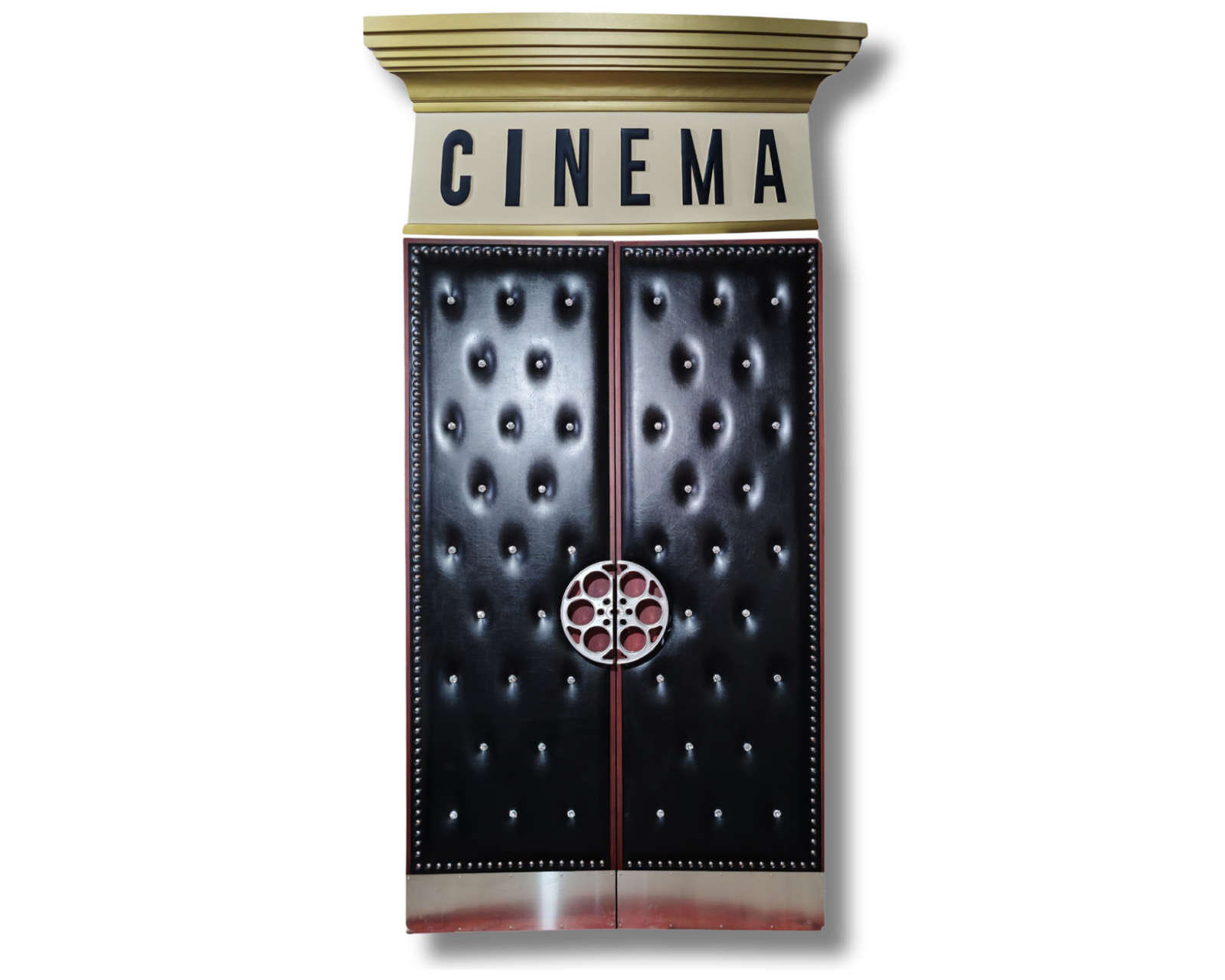 A custom home theater double door system by Crown Custom Doors, featuring a grand overhead decorative "CINEMA" marquee sign header, sleek black upholstered acoustic vinyl panels with diamond-tufted crystal studs, chrome nailhead trim, a split silver film reel handle, and integrated stainless steel kickplates.