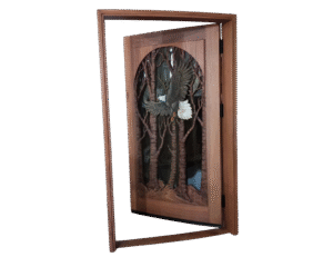 Custom hand-carved solid mahogany single swing bald eagle front door shown open within its matching wood jamb frame, featuring a soaring eagle carving and glass panel.
