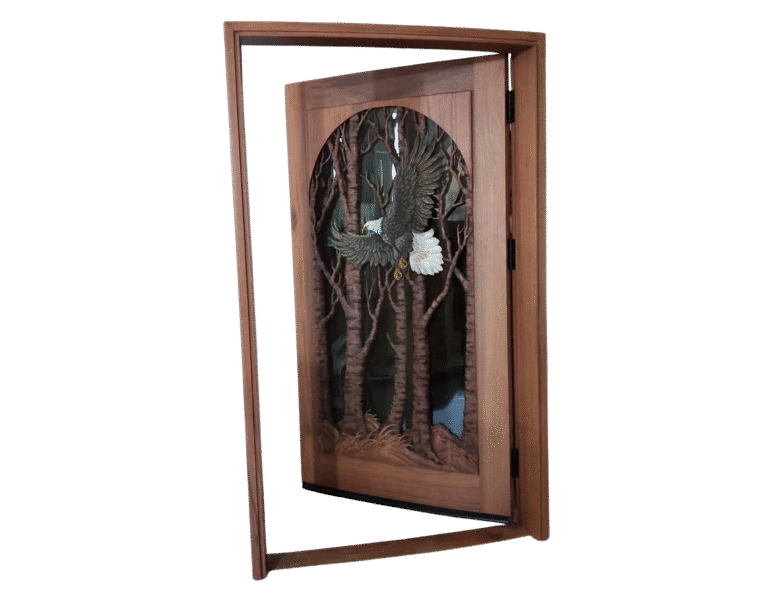 Custom hand-carved solid mahogany single swing bald eagle front door shown open within its matching wood jamb frame, featuring a soaring eagle carving and glass panel.