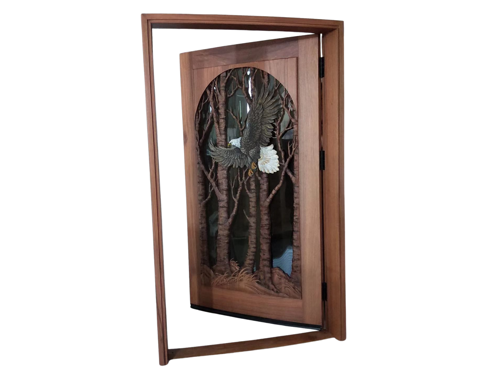 Custom hand-carved solid mahogany single swing bald eagle front door shown open within its matching wood jamb frame, featuring a soaring eagle carving and glass panel.