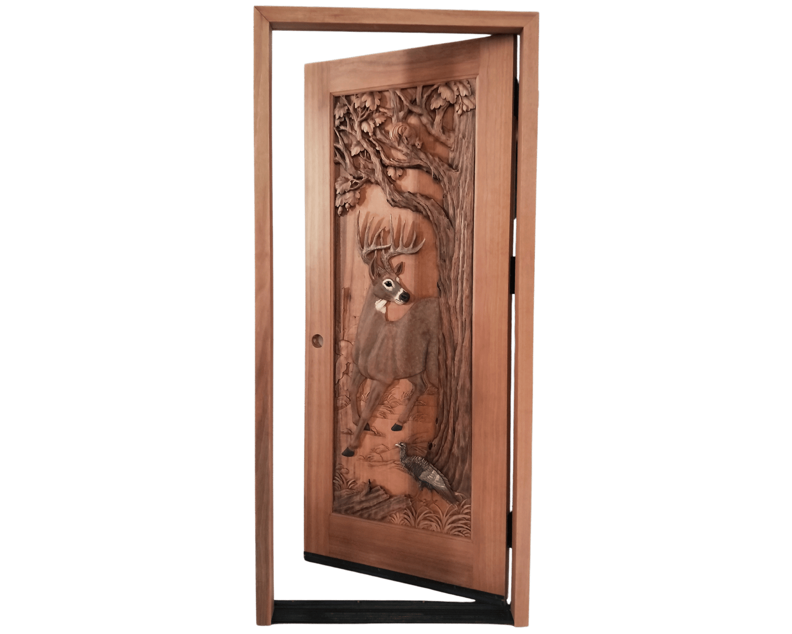 Front studio view of an open pre-hung solid wood single swing entry door featuring a hand-carved trophy buck deer, wild turkey, squirrel, and oak tree relief inside a flat-top jamb.