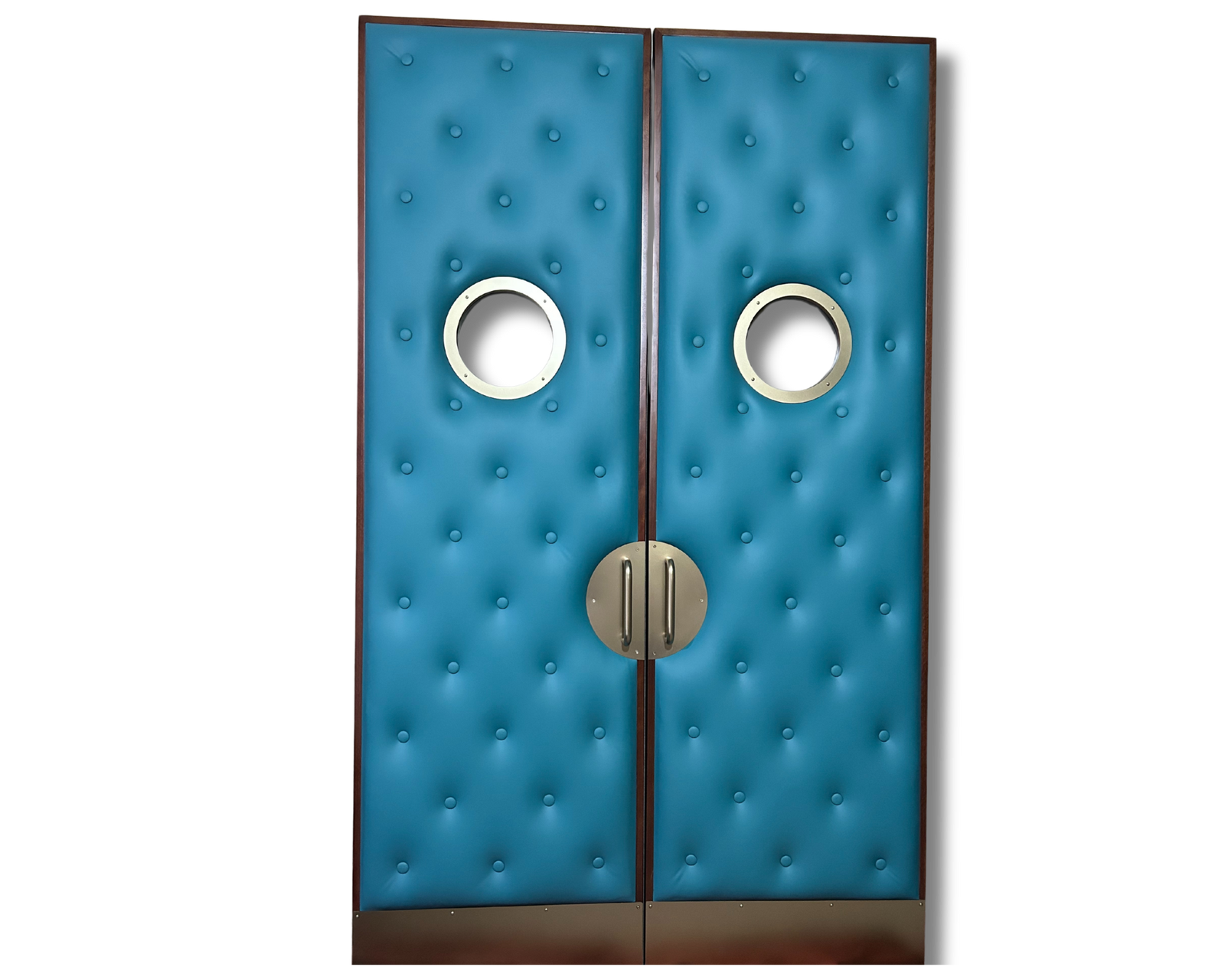 A premium standalone home cinema double door system by Crown Custom Doors, featuring vibrant teal blue upholstered acoustic vinyl with a diamond-tufted button pattern, circular silver porthole viewing windows, a custom half-moon silver pull handle assembly, and matching satin kickplates.