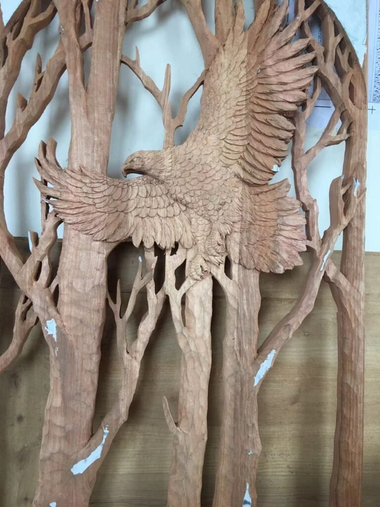Unfinished solid mahogany wood panel with a fully hand-carved soaring bald eagle and birch trees motif, prepared for a custom front door insert.