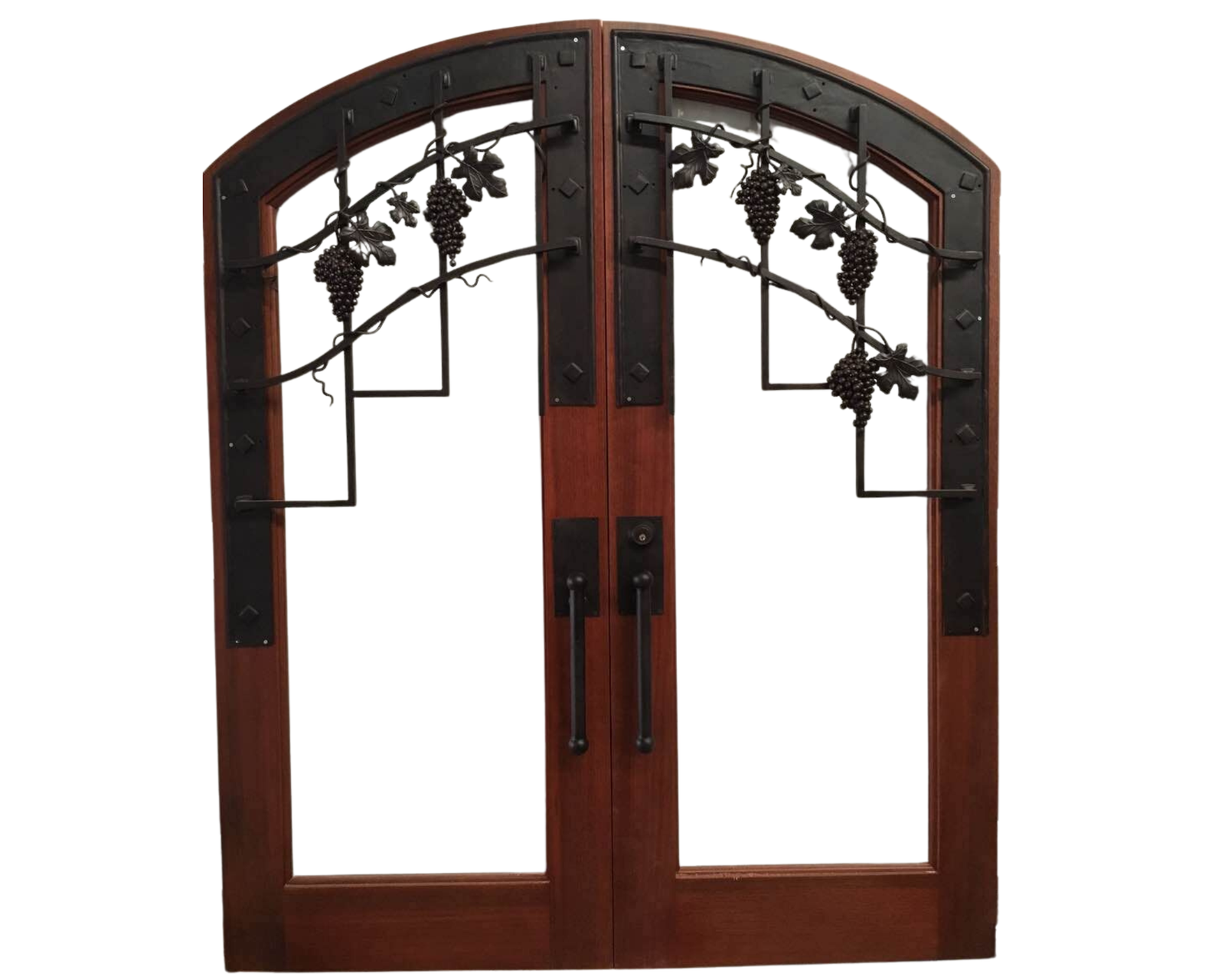 An arched solid wood double door set featuring custom hand-forged black iron grills designed with intricate grape clusters and vine leaves over open glass panels.