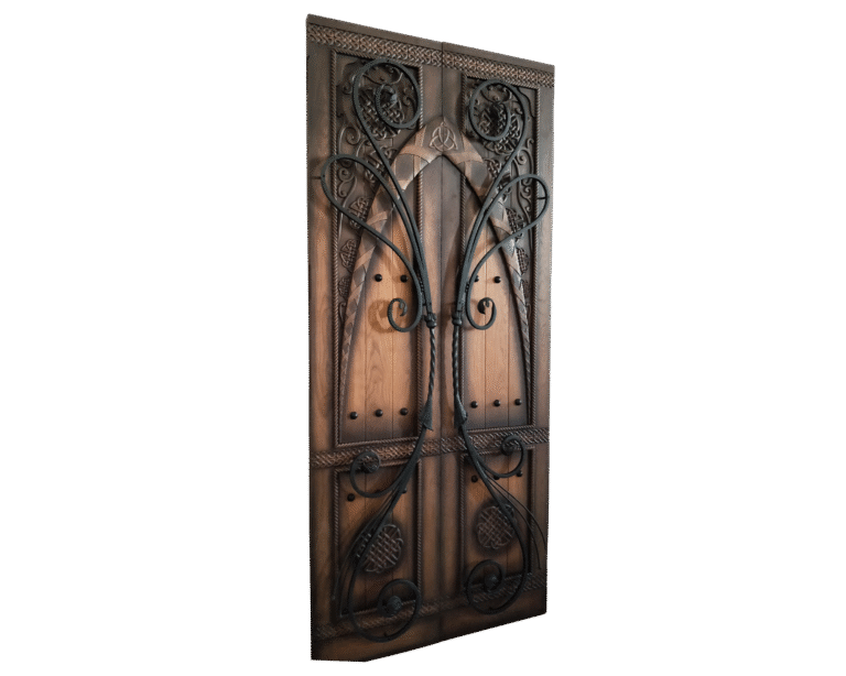 A front product view of a luxury Gothic solid white oak double entry door system by Crown Custom Doors, isolated on a black background, highlighting hand-carved Celtic knots, braided relief borders, decorative black clavos studs, and dramatic sweeping hand-forged black wrought iron scroll overlays.