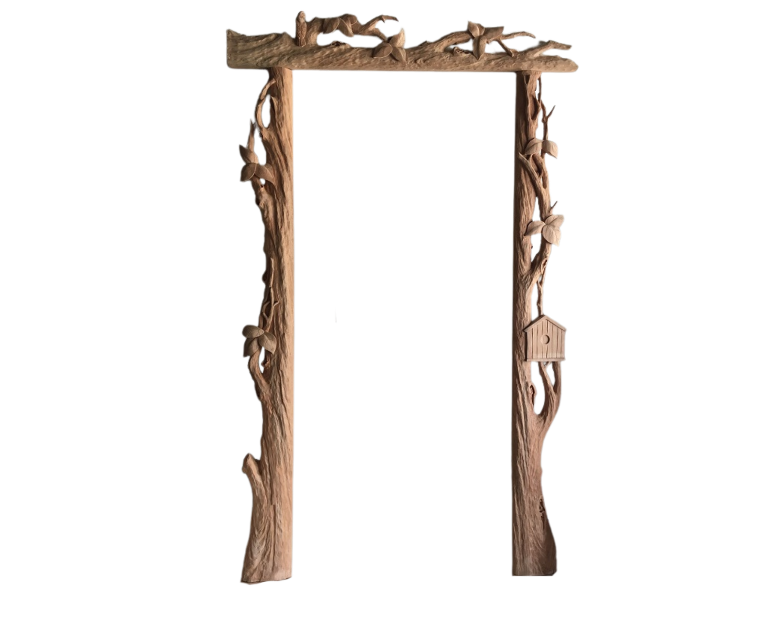 Handcrafted solid wood exterior door casing surround featuring 3D carved tree branch textures, natural leaf details, and a built-in wooden birdhouse accent against a black background.