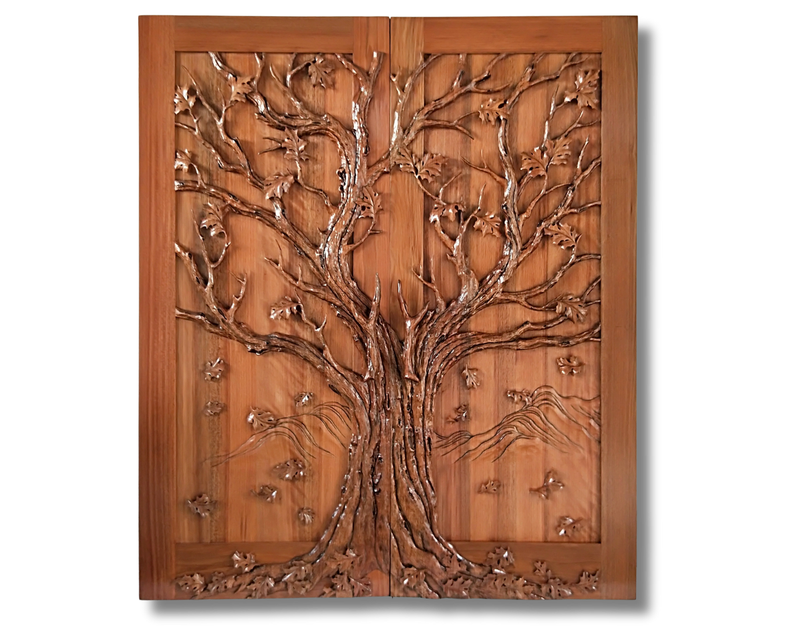 Custom handcrafted solid wood double entry door featuring a continuous 3D high-relief carving of a spreading oak tree with detailed bark textures and falling leaves across both panels by Crown Custom Doors.