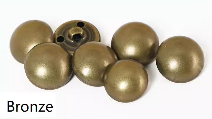 Collection of smooth, domed antique bronze mushroom-style metal buttons with shank backs used for diamond tufted leather and vinyl door upholstery.