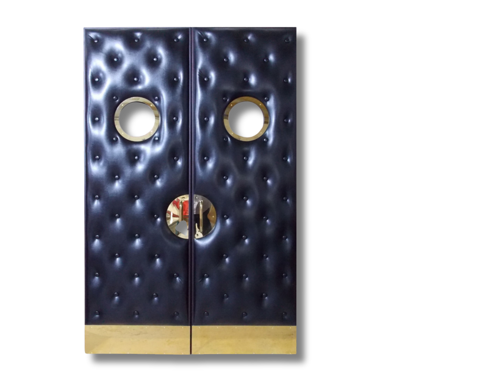 Double black diamond-tufted vinyl acoustic home theater doors featuring circular porthole vision glass panels, champagne gold electroplated circular pull handles, and protective kick plates by CROWNCUSTOMDOORS.