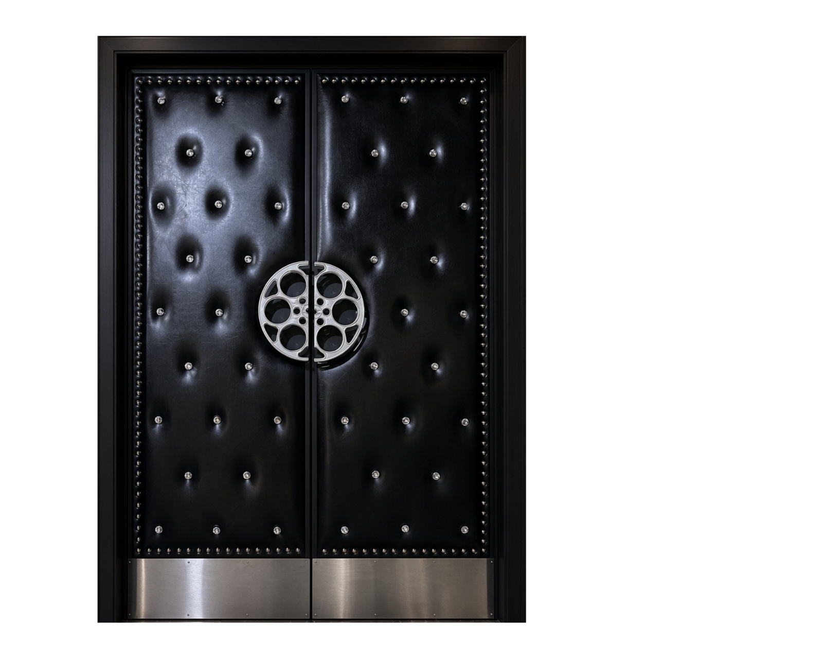 Custom black upholstered acoustic home theater double doors on a black background featuring crystal diamond tufted buttons, silver stud trim, silver film reel handles, and stainless steel kickplates by Crown Custom Doors.