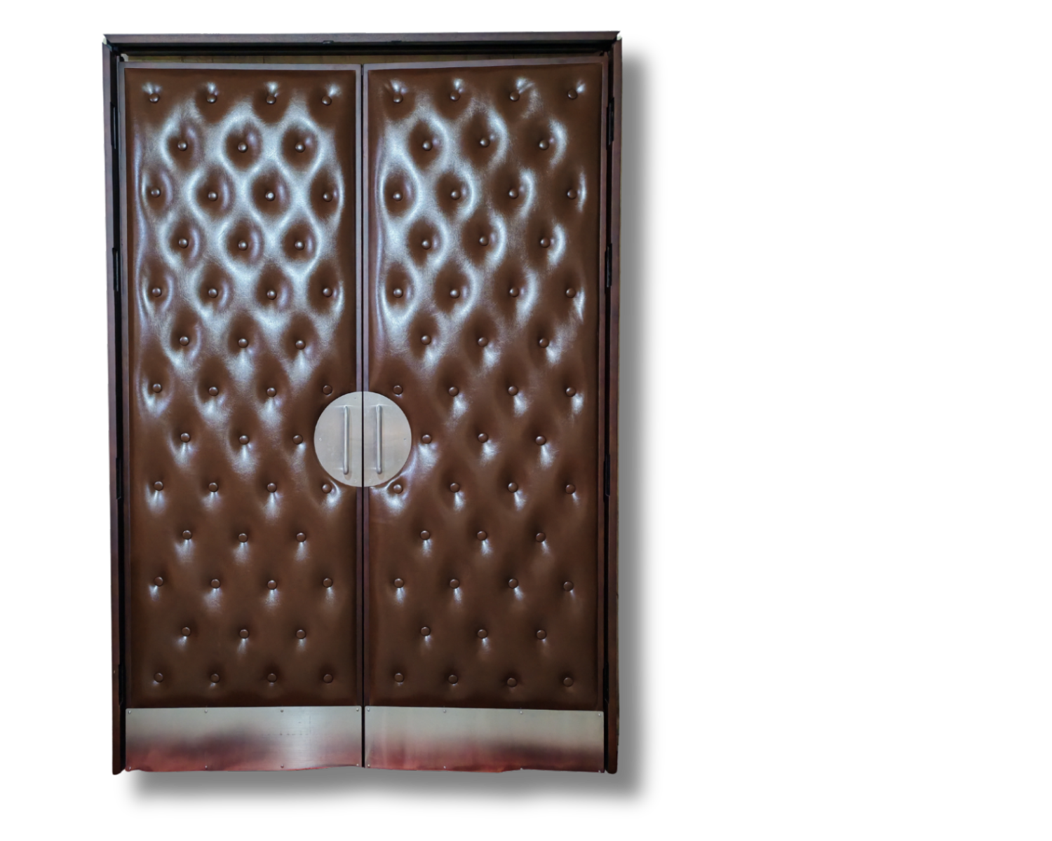 Custom brown button-tufted vinyl acoustic home theater double doors featuring semi-circular brushed silver pull handles and metallic bottom kickplates set against a dark background.