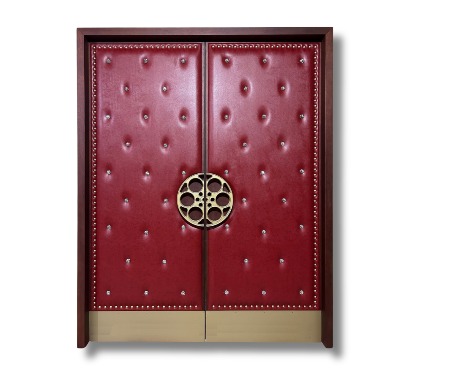 Double burgundy red diamond-tufted leather acoustic home theater doors featuring custom gold film reel handles, crystal button tufting, silver stud trim, and gold kick plates by CROWNCUSTOMDOORS.