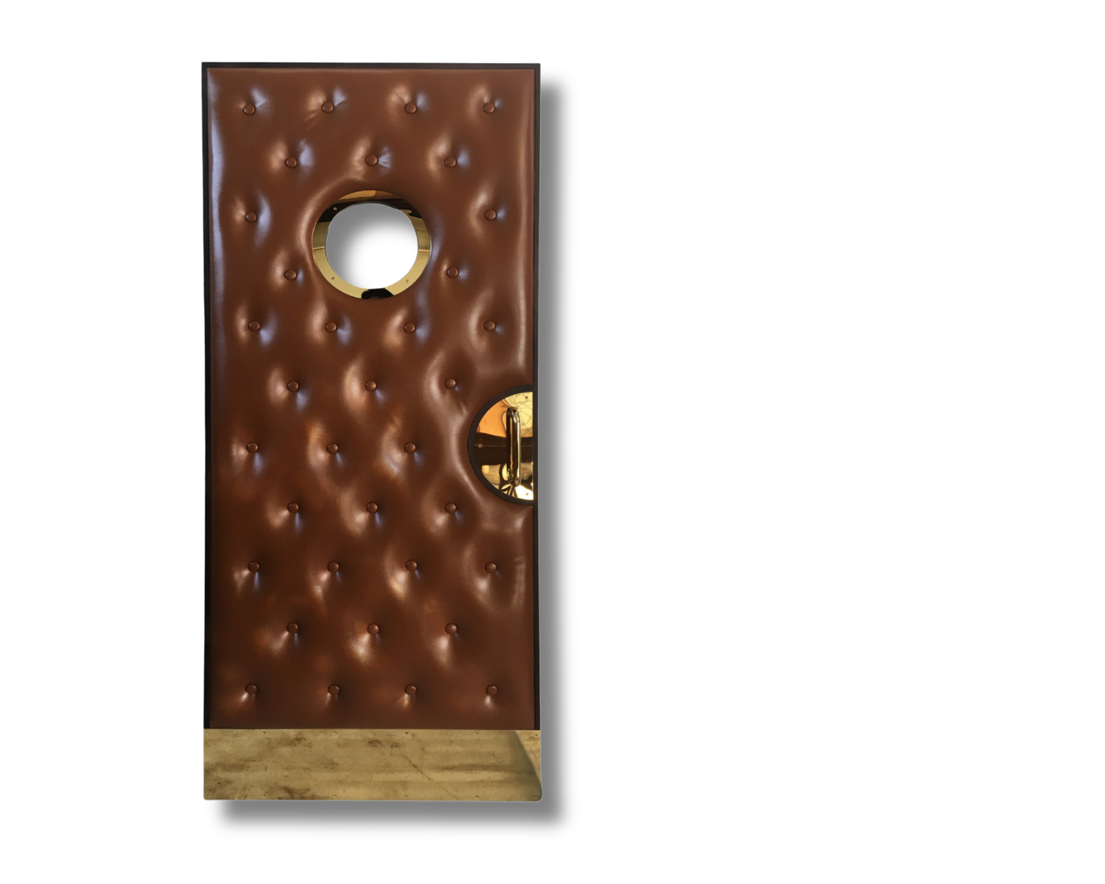 Custom soundproof home theater door featuring deep chestnut brown button-tufted leather upholstery, a circular brass porthole viewing window, a gold film reel pull handle, and a brass kick plate.