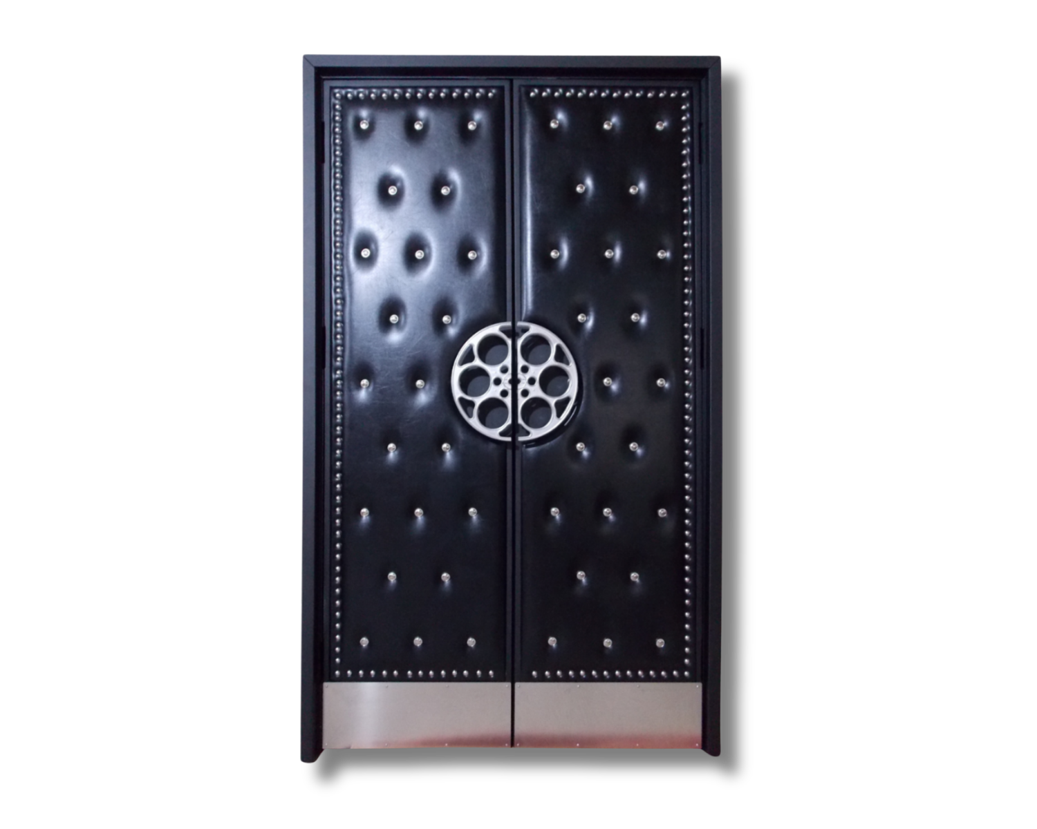 Custom double home theater doors with black button-tufted leatherette vinyl, silver nailhead trim border, circular film reel pull handles, and brushed metal kick plates.