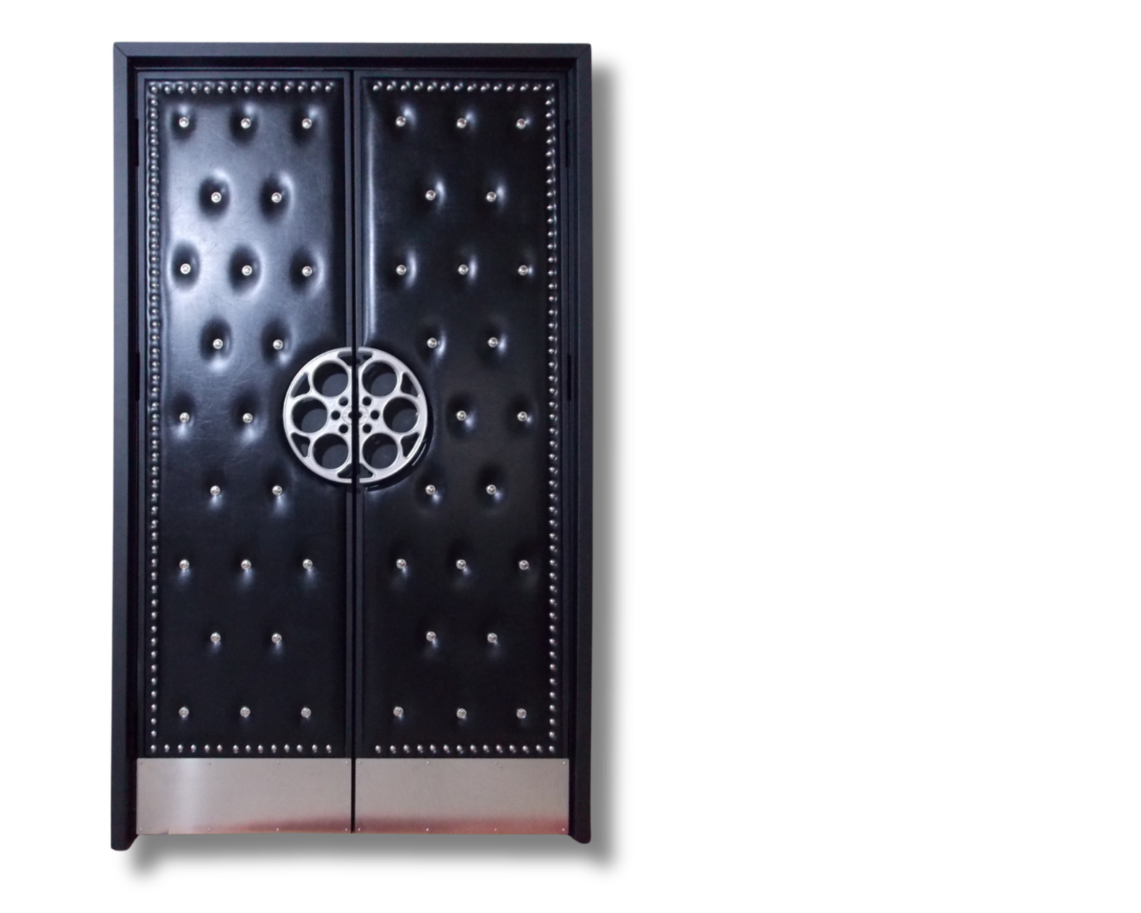 Front Studio view of Natalie Kelpin custom soundproof double doors upholstered in tufted black vinyl with silver accent buttons, perimeter silver nailhead studs, stainless steel kickplates, and cast aluminum film reel handles by Crown Custom Doors.