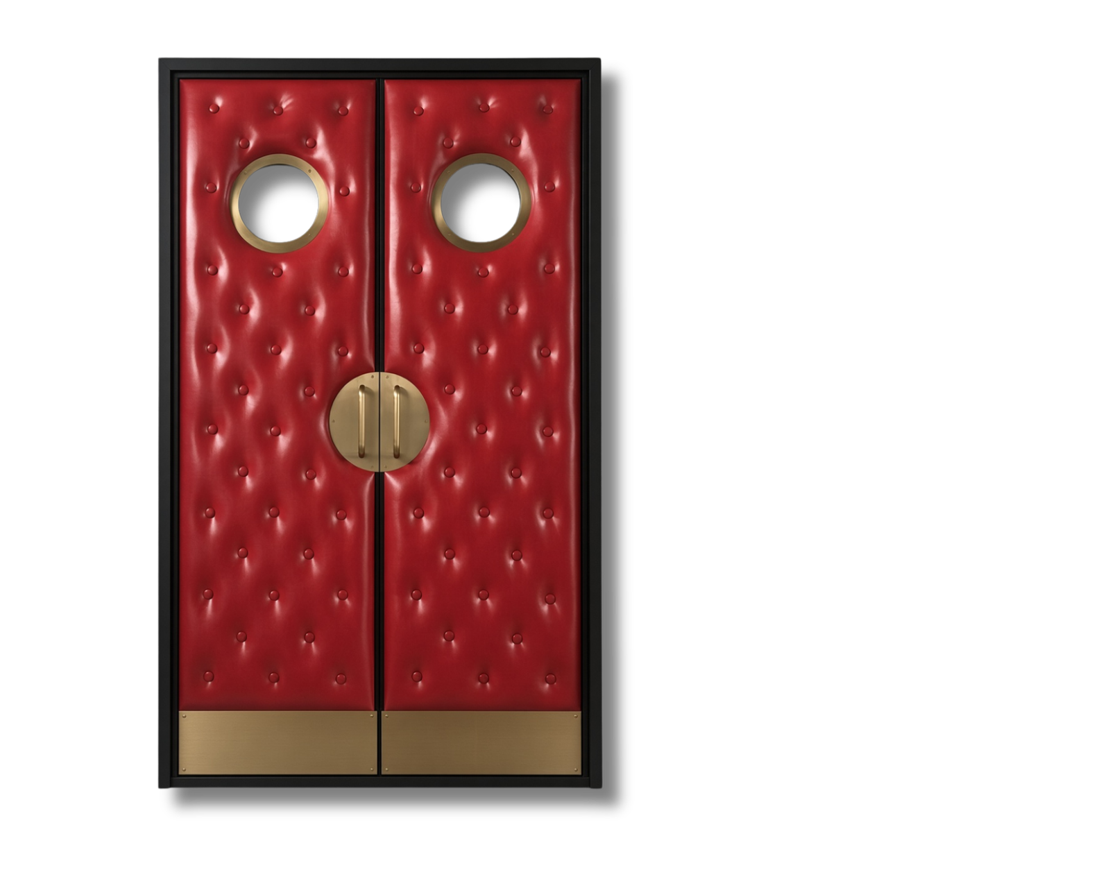 Front view of custom red vinyl diamond-tufted acoustic home theater double doors isolated on a black background, featuring brass porthole vision windows, round brass handles, and kick plates by Crown Custom Doors.