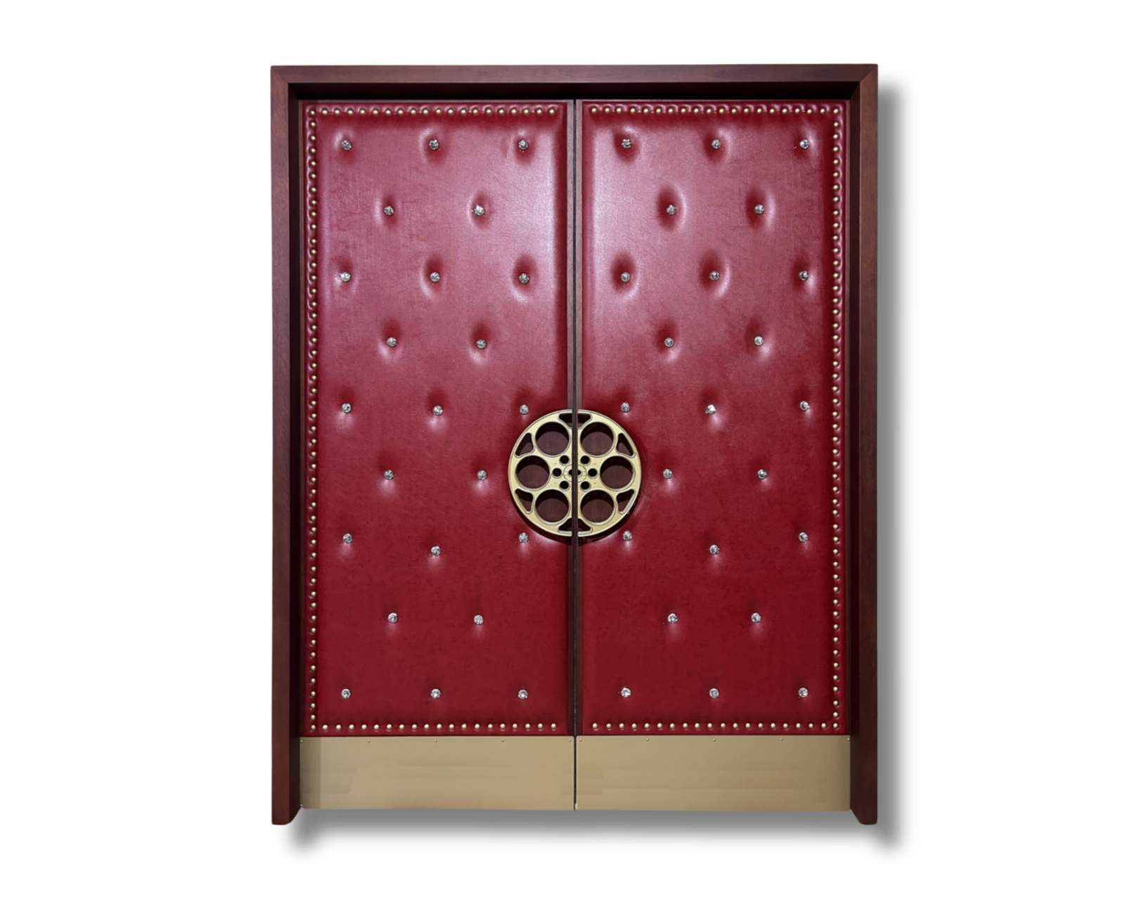 Custom deep red tufted leatherette acoustic home theater double doors with crystal buttons, perimeter stud trim, gold film reel pull handles, and a brass kick plate.