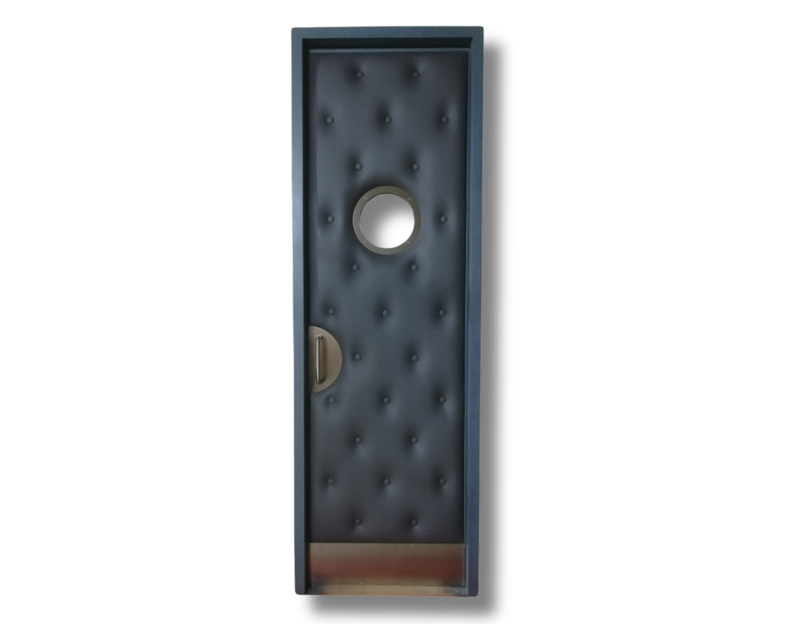 Custom dark grey button-tufted upholstered acoustic home theater door featuring a round porthole vision window, vintage-style pull handle, and protective brass kick plate.