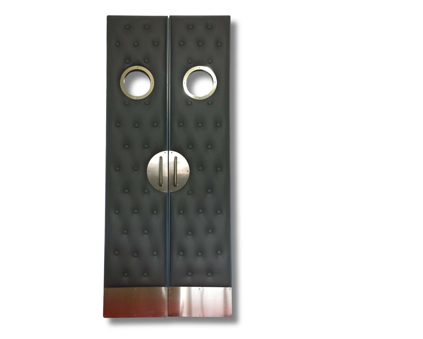 Double story gray tufted upholstery acoustic home theater doors featuring circular porthole vision glass panels, champagne gold electroplated circular pull handles, and protective kick plates by CROWNCUSTOMDOORS.